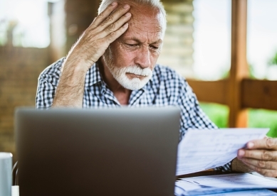 Senior man looking at paperwork