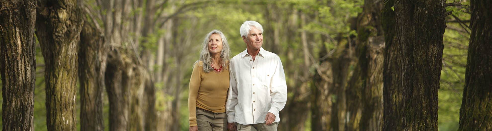 Couple walking down path in park