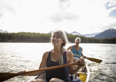 Mature Couple Canoeing on Lake